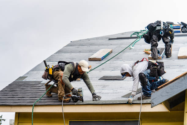 Professional Roofing technician working in Brightwaters, NY